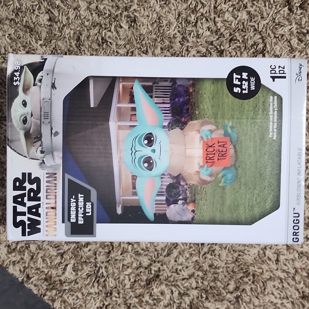 Star Wars Mandalorian Inflatable with Baby Yoda and Orange Sign